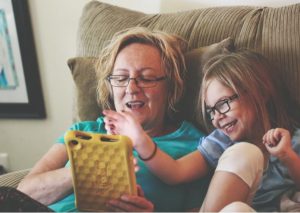 Tips to be happy. Grandmother reading with her granddaughter